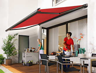 Markilux 990 patio awning in red over patio dining area